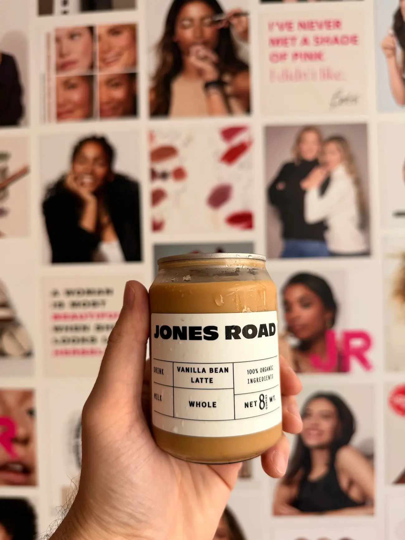 Arbour Coffee Co. canned latte poured over ice in a clear cup