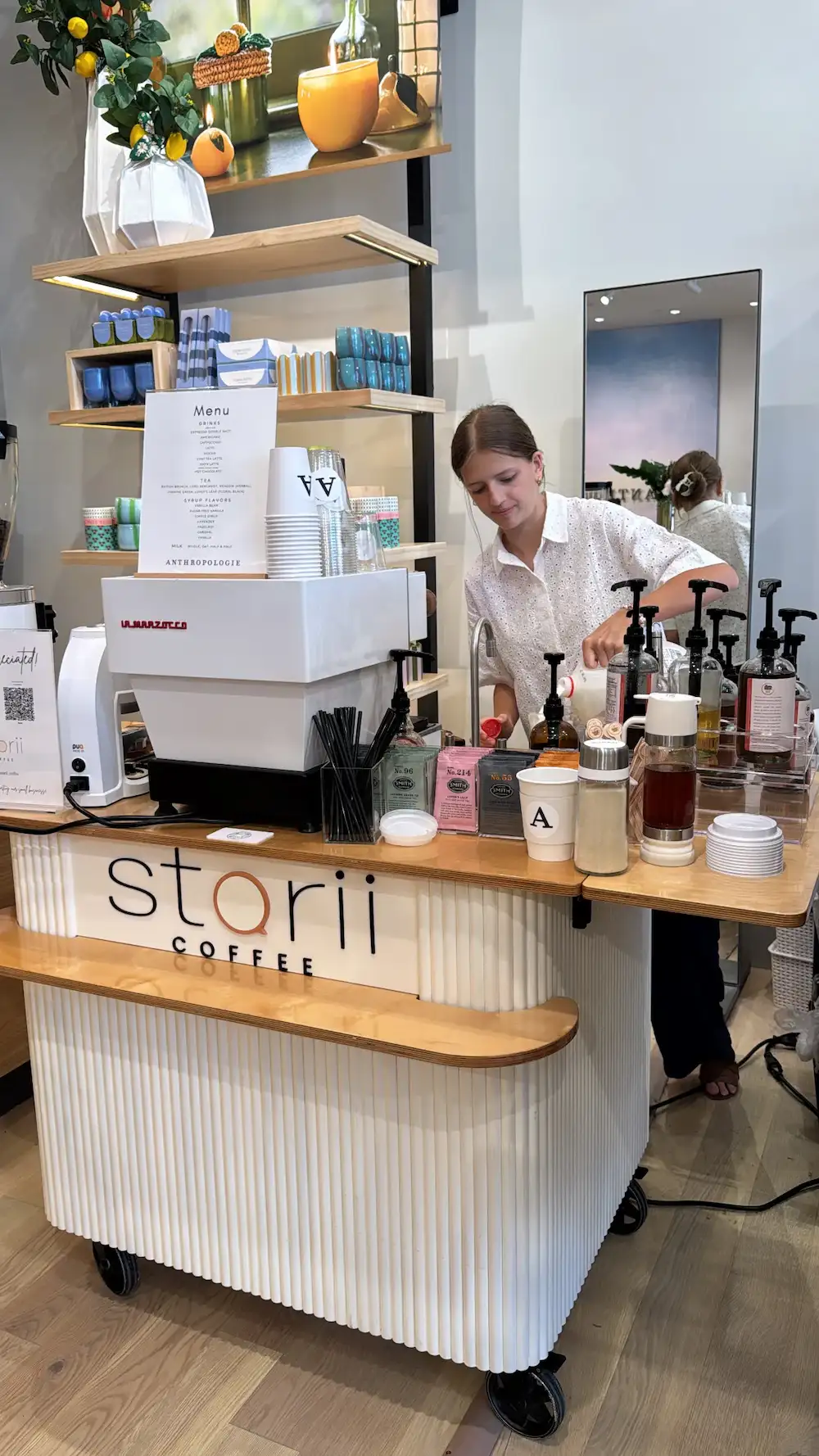 Storii Coffee barista preparing drinks at the cart during an in-store activation