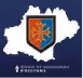 Blason orange et bleu avec un lion stylisé sur une silhouette blanche de la région Occitanie.