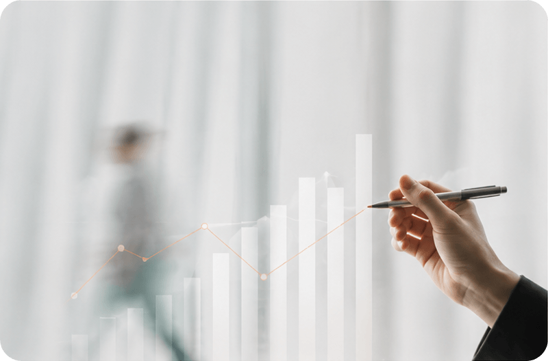 Hand pointing at a data analytics dashboard with marketing performance charts