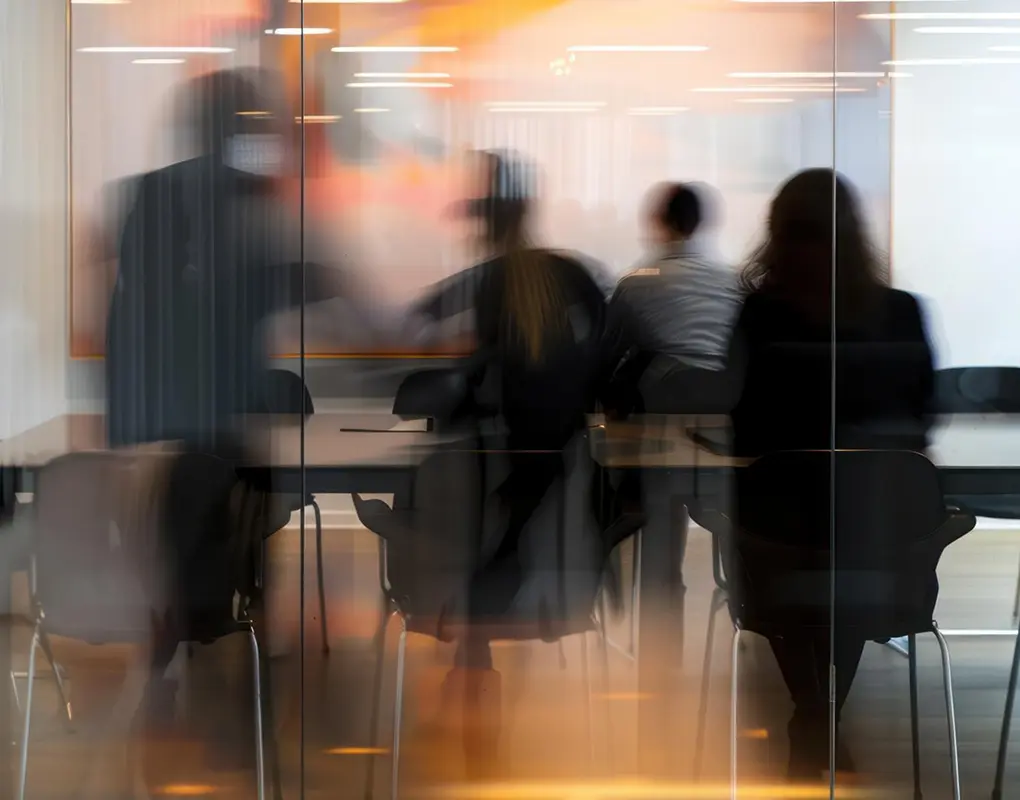 Blurred motion photo of colleagues walking through an office