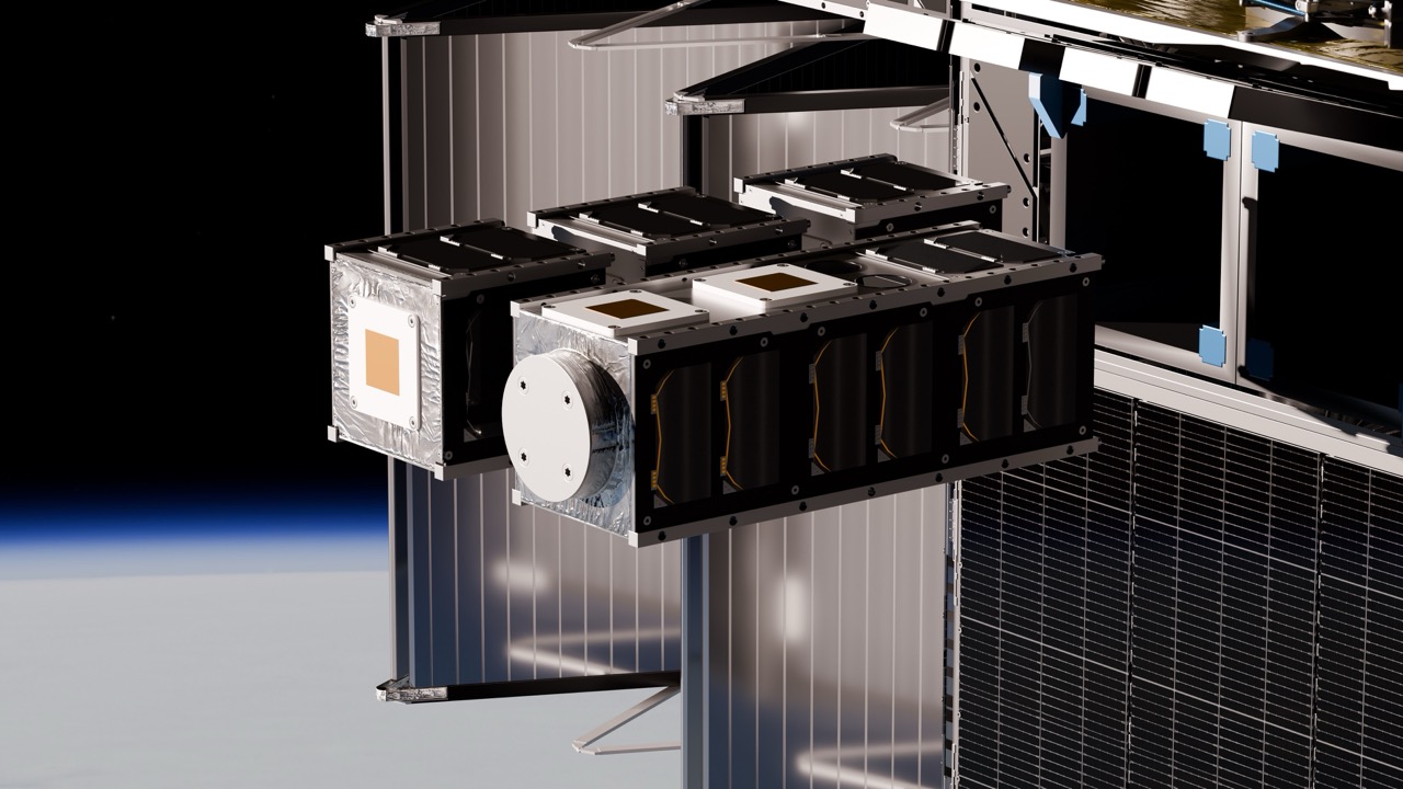 Rendering of modular spacecraft hardware beside space-station solar arrays above Earth.