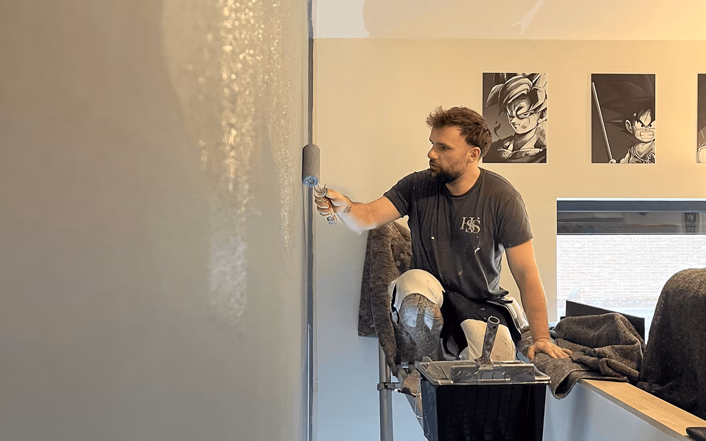 Professional painter painting an interior wall