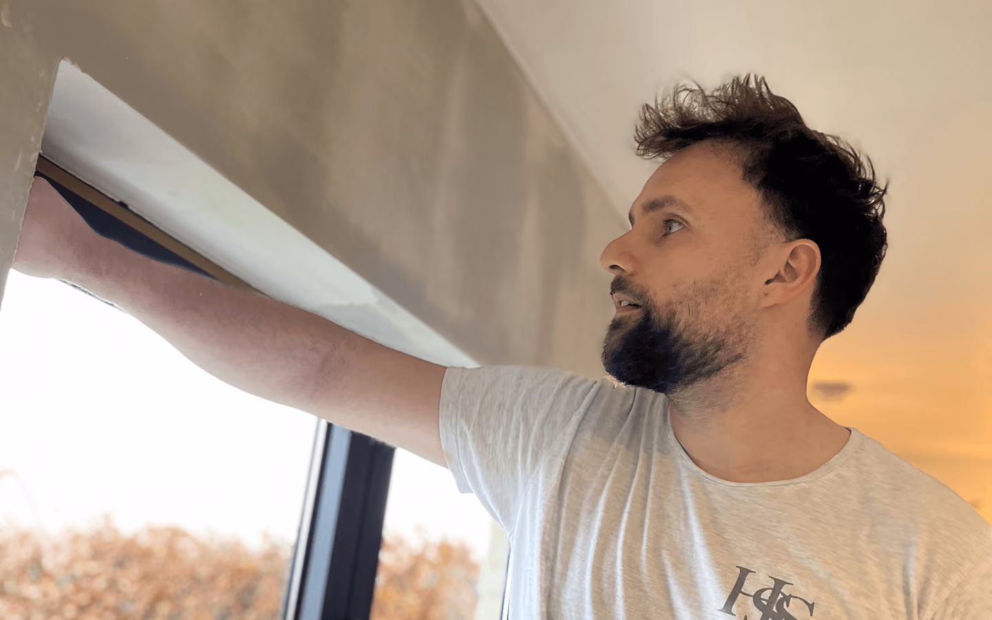 Professional painter painting an interior wall