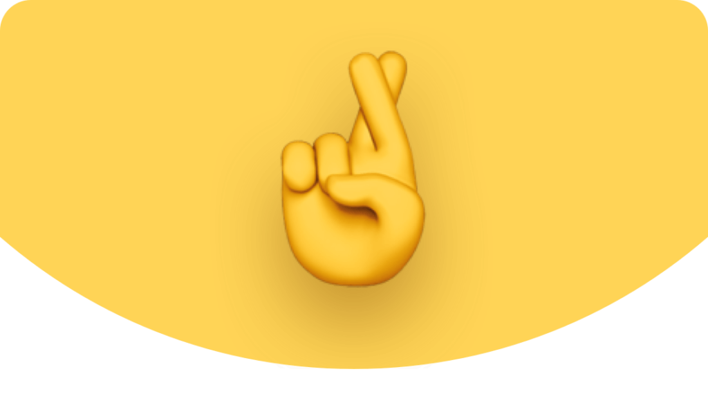 A yellow crossed-fingers emoji centered on a yellow background with a curved black edge at the bottom.