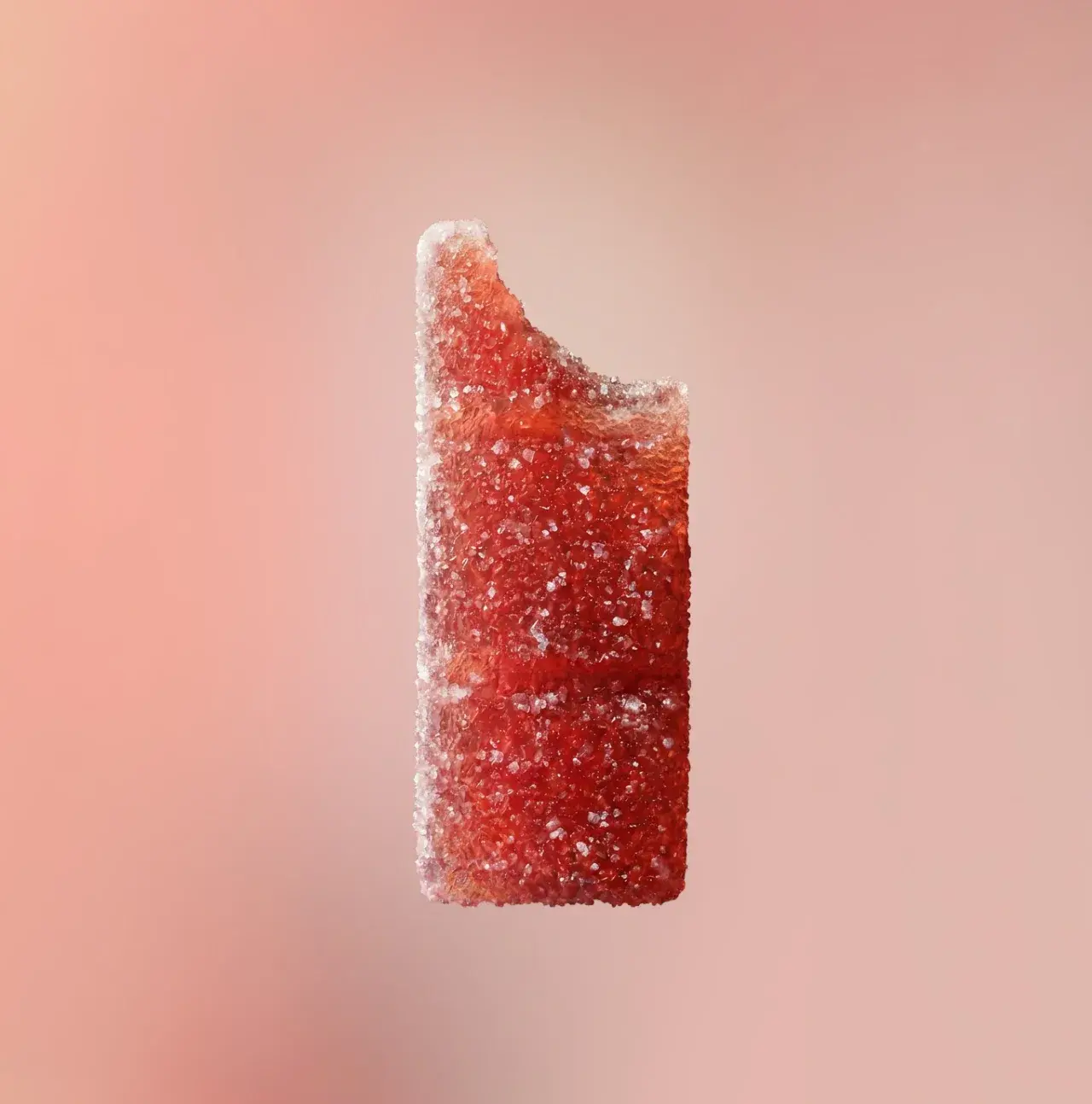 Rode pâte de fruits-reep met een hap eruit