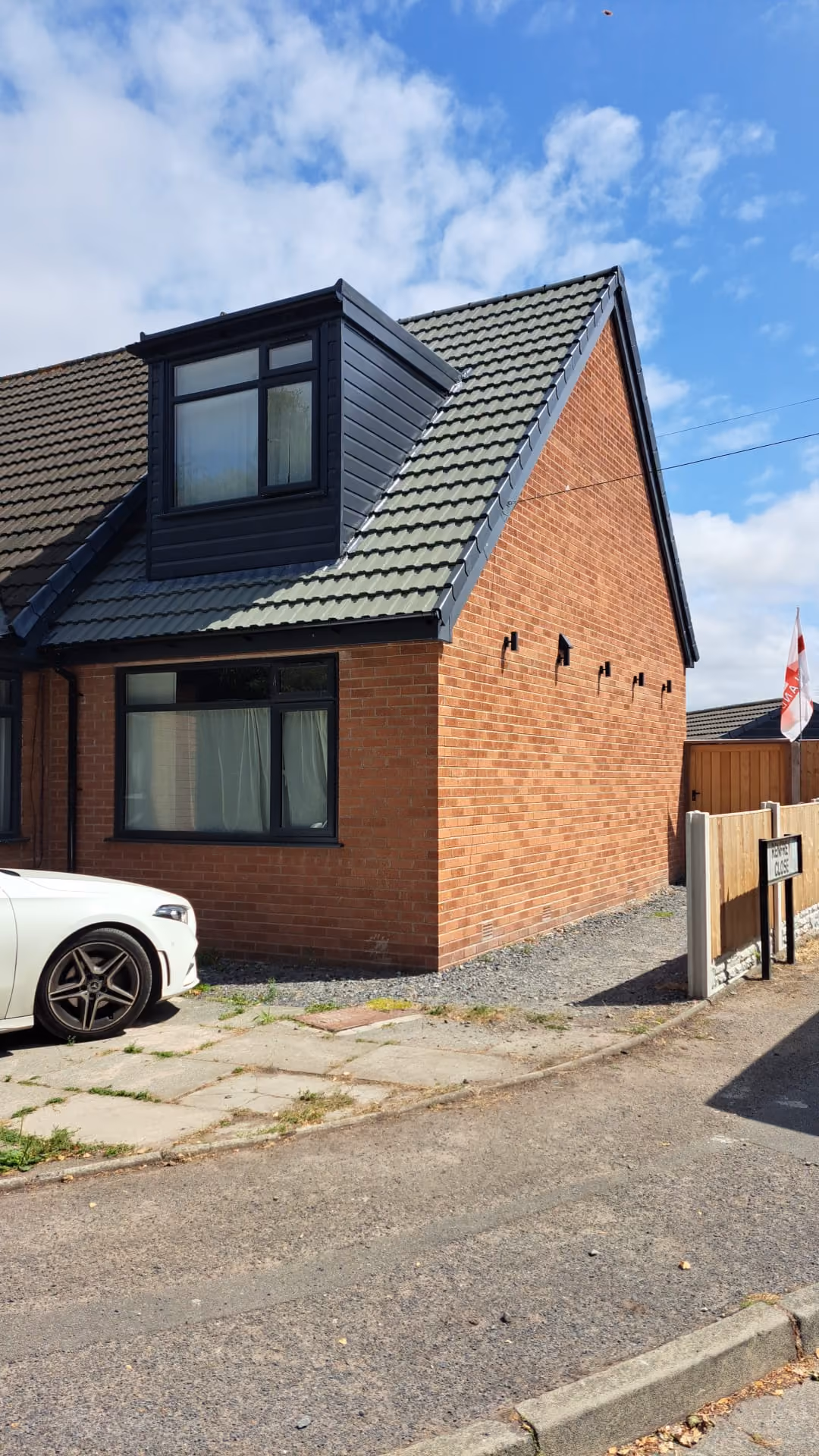 Anthracite grey uPVC windows and matching dormer cladding fitted to a semi detached home near Ormskirk