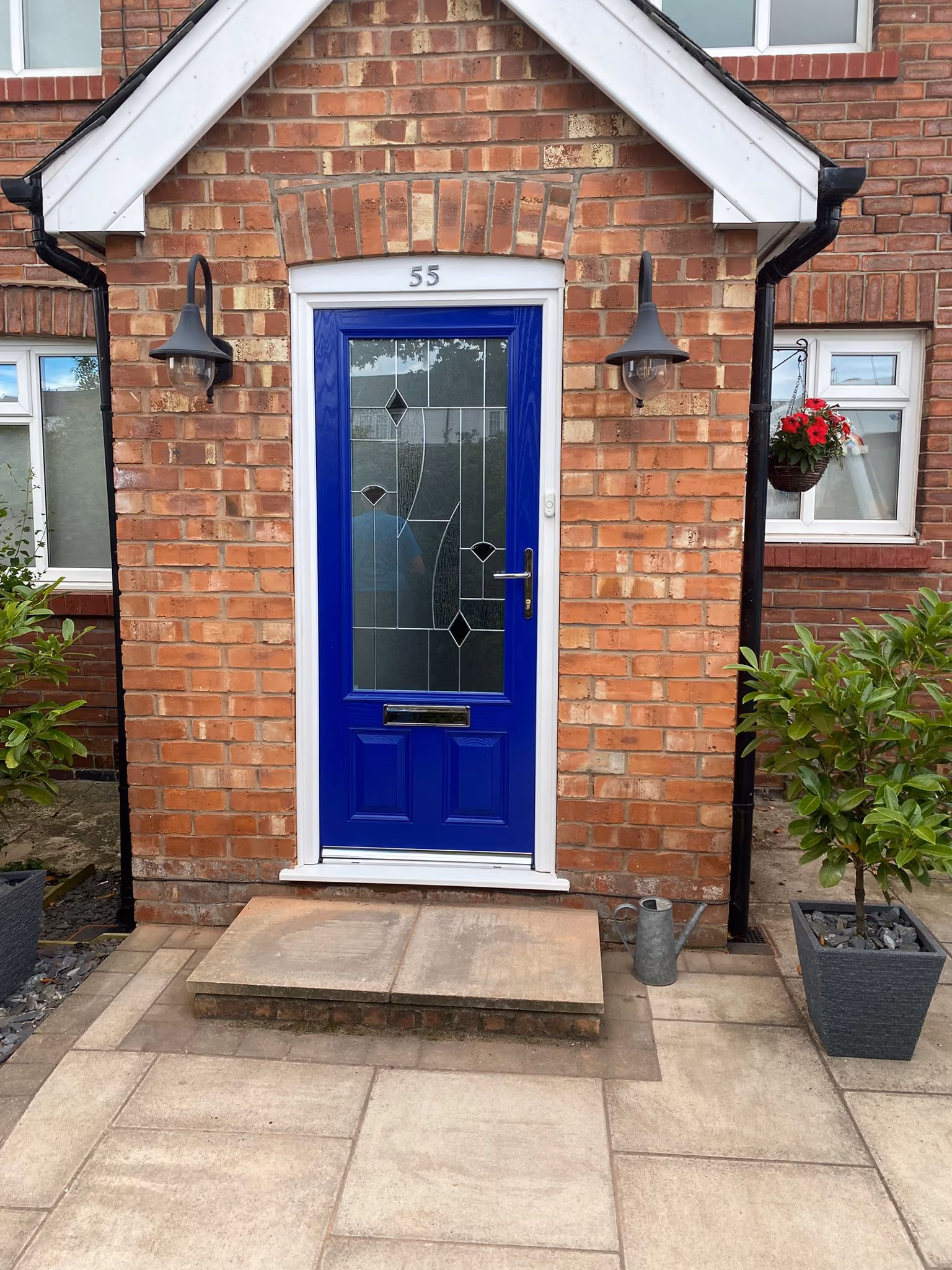 Bright blue composite front door with decorative leaded glass and chrome furniture fitted in Ormskirk