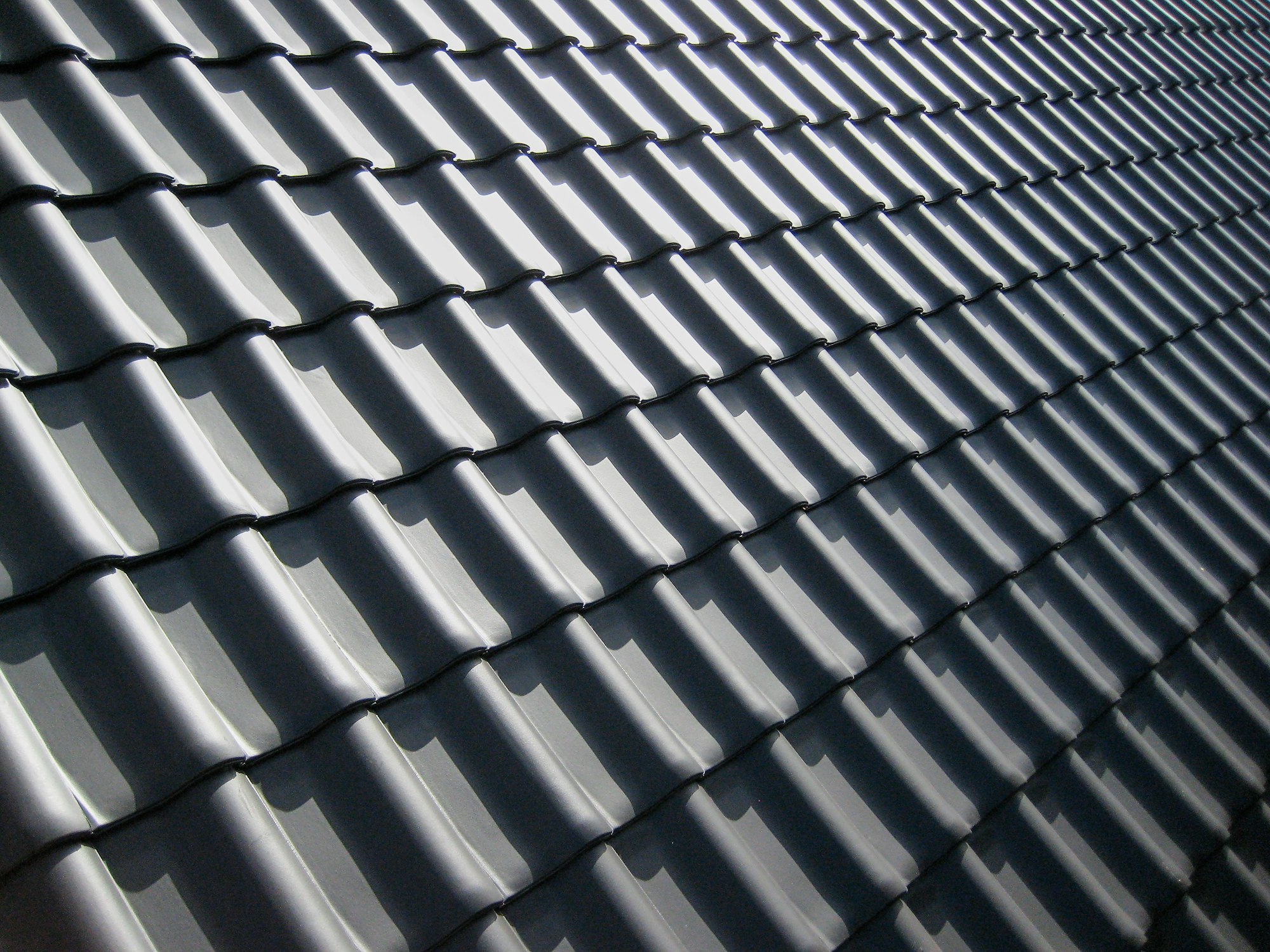 Roofing contractor at work on a residential roof