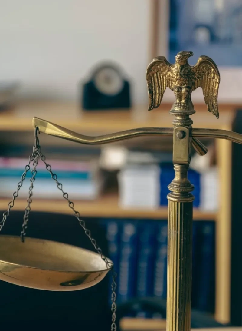 Brass scales of justice in a law library representing Montana probate court