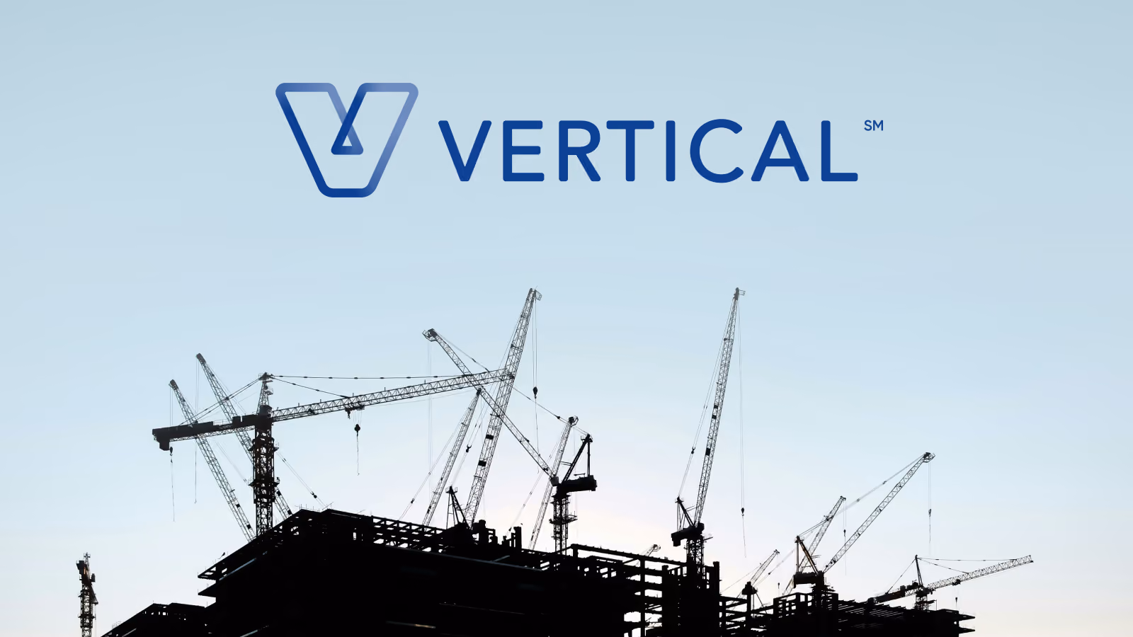 Silhouetted construction cranes above buildings under clear sky with Vertical brand logo above.
