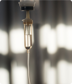 Close-up of IV infusion drip bottle for peptide therapy treatment
