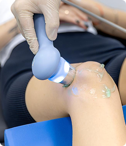 Targeted ultrasound-guided regenerative therapy applied to knee cartilage for joint pain relief and inflammation reduction.