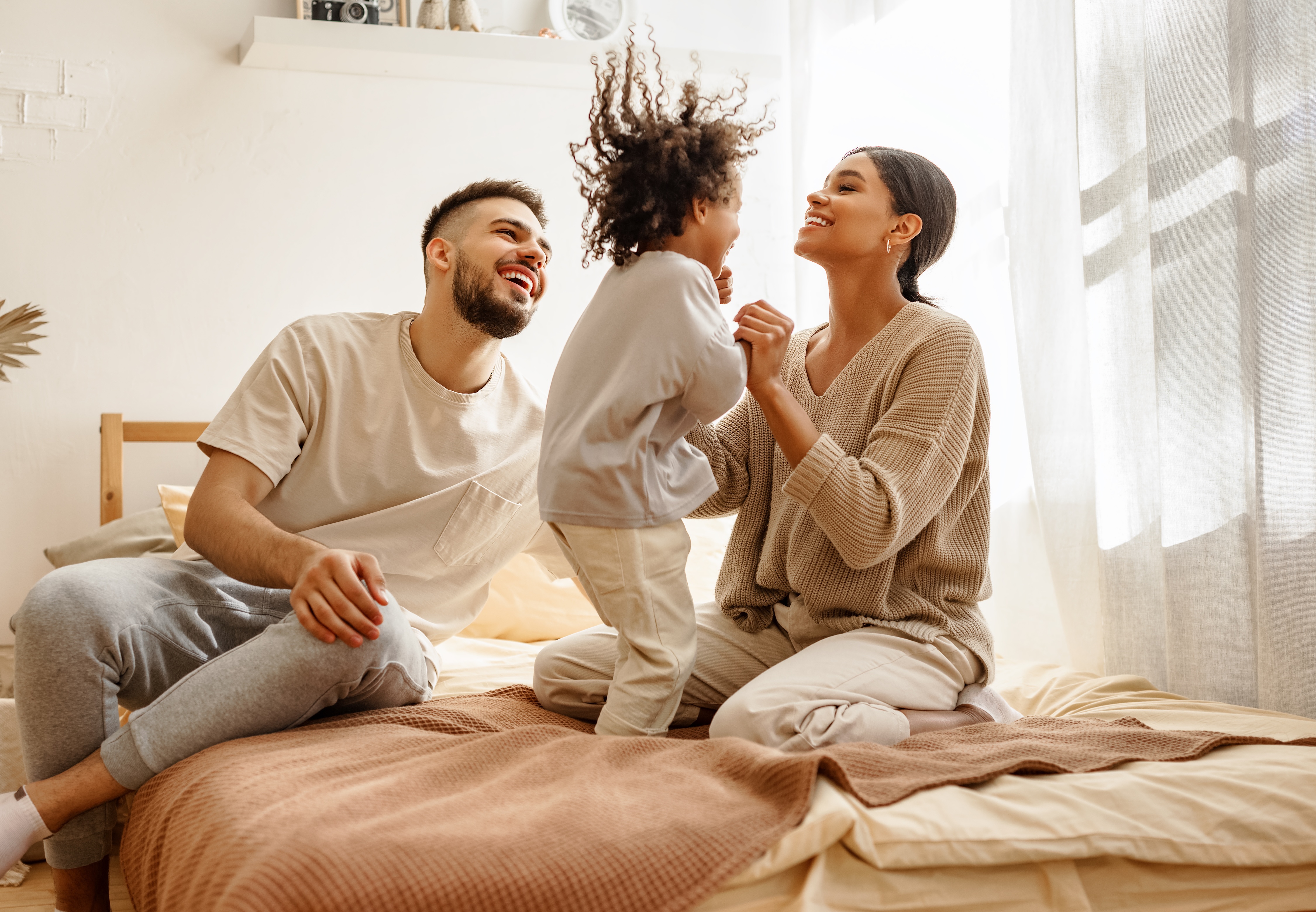 Family on the bed stock image