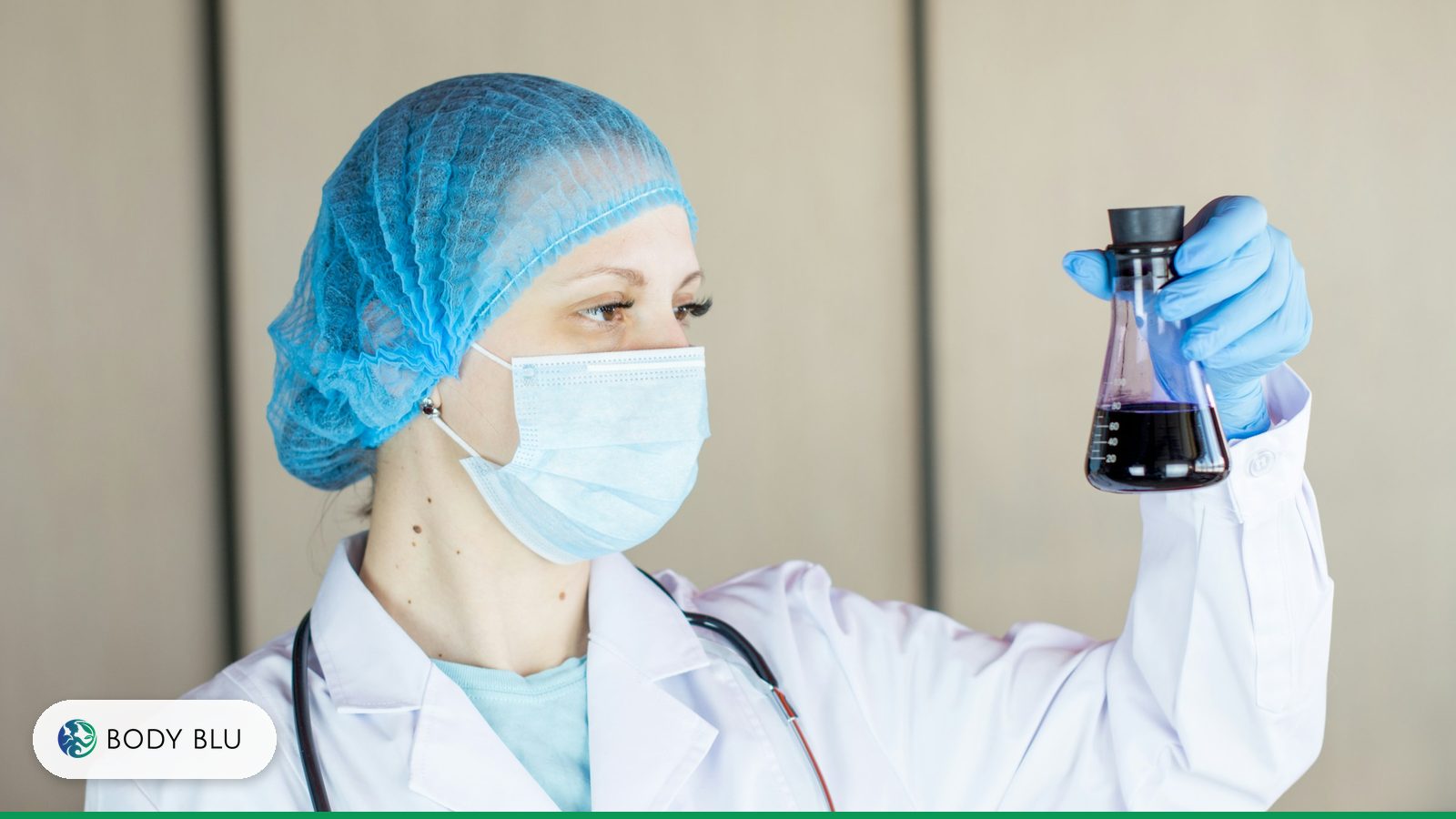 Researcher in a lab coat, mask and gloves examining a flask of liquid, representing early research on the BPC-157 peptide