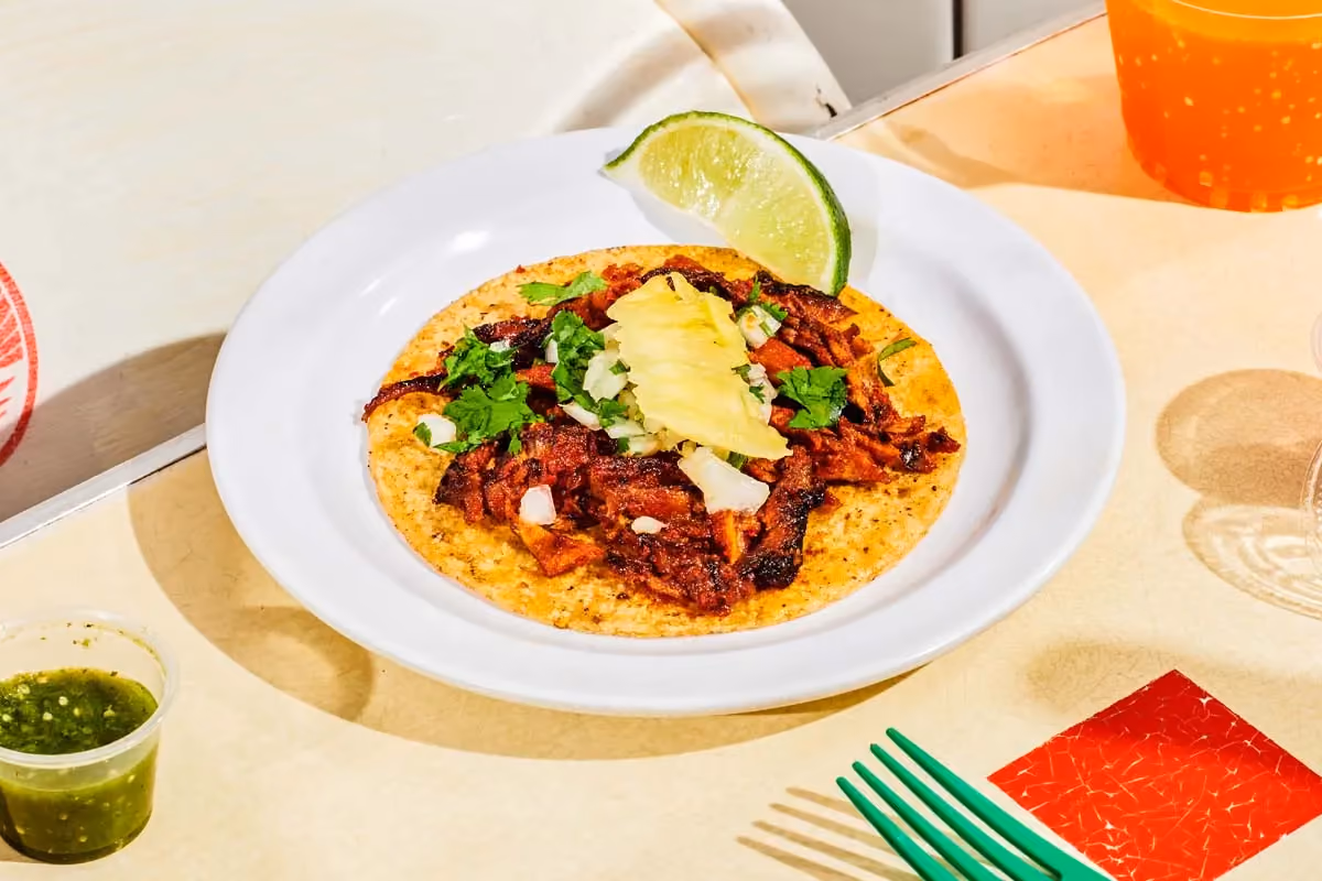 Al pastor tacos with trompo-roasted pork, cilantro, onions and pineapple