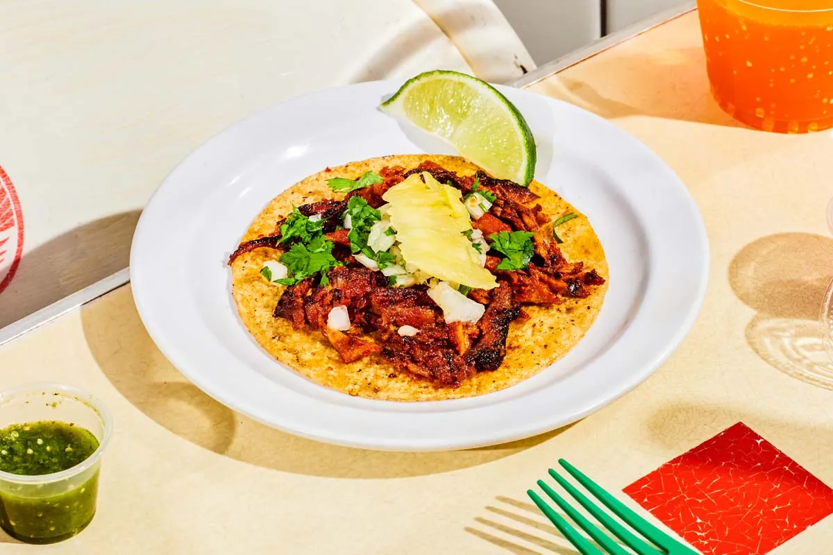 Al pastor tacos with trompo-roasted pork, cilantro, onions and pineapple