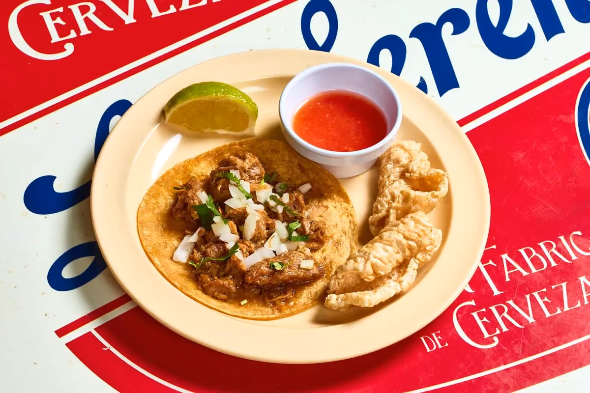 Carnitas taco with slow-braised crisped pork and crispy chicharrón