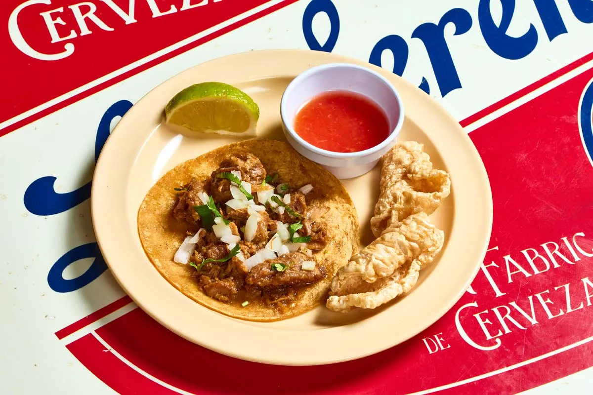 Carnitas taco with slow-braised crisped pork and crispy chicharrón