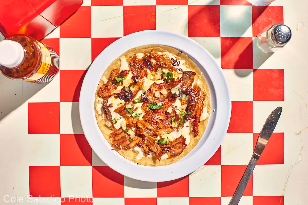 Al pastor quesadilla with roasted pork, melted cheese, cilantro and onion