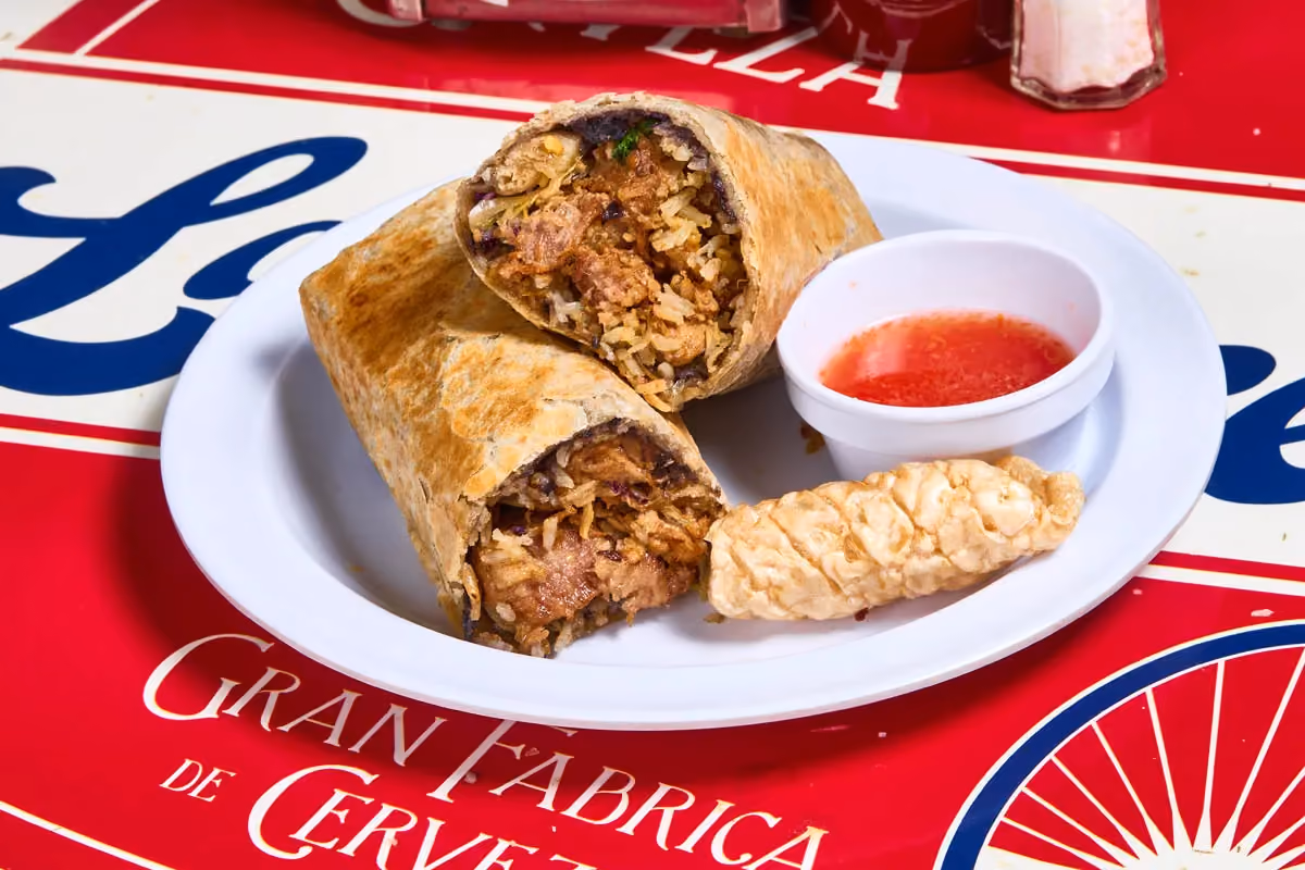Carnitas burrito with slow-braised pork, rice, beans and crispy chicharrón