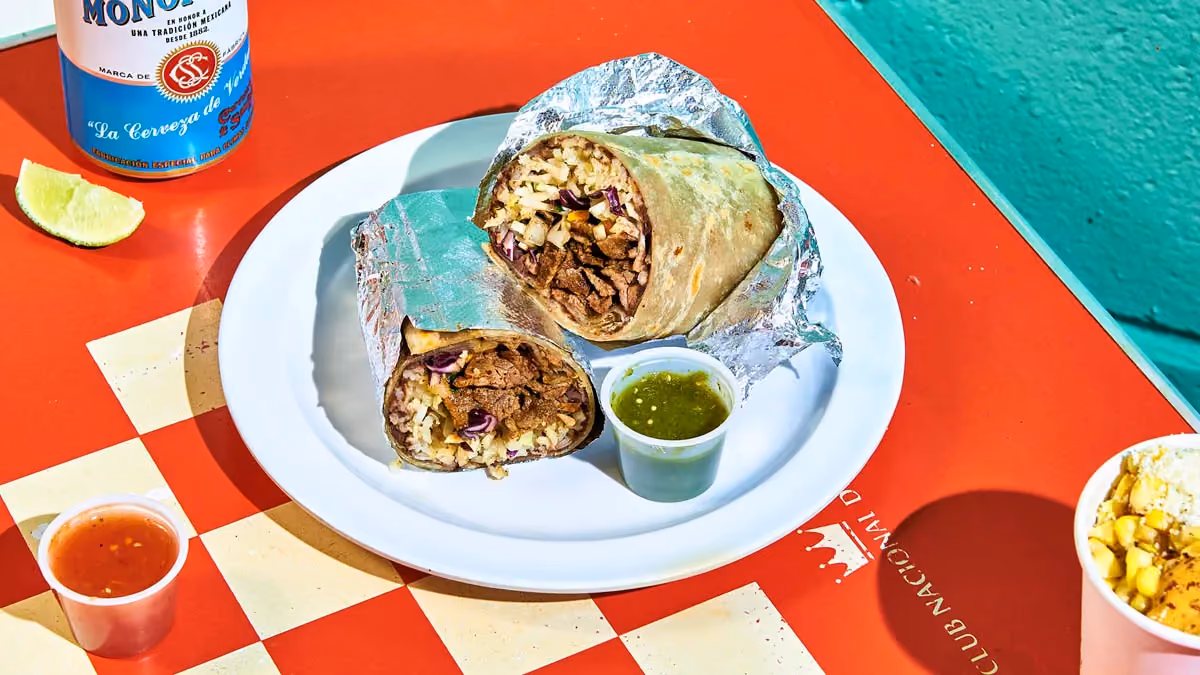 Carne asada burrito with seared beef, rice, beans, cabbage and salsa