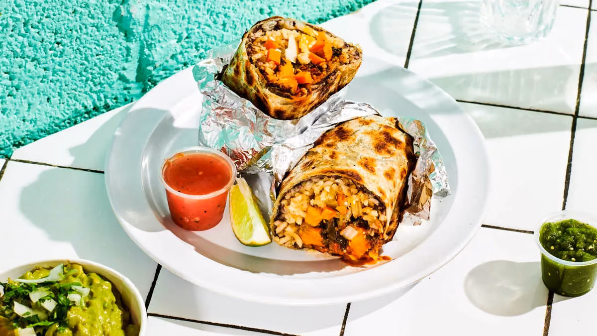 Vegana burrito with roasted sweet potato, kale, poblano rajas, rice and beans