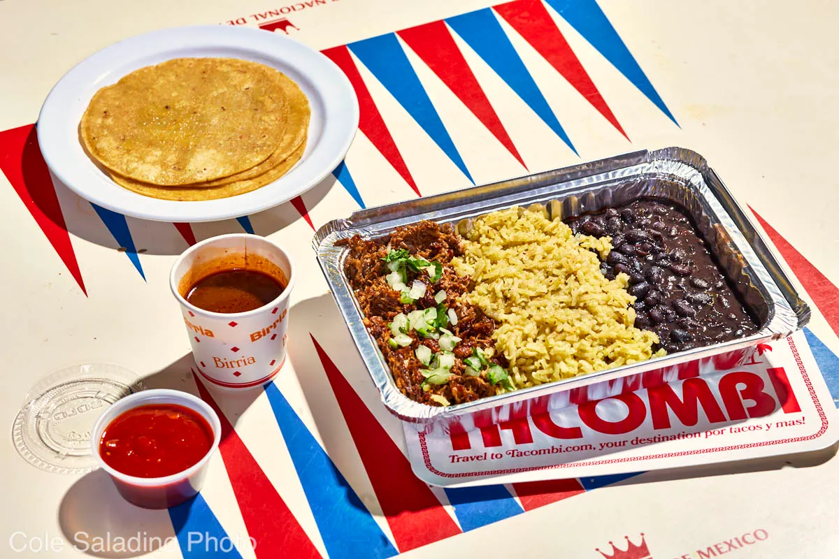 Beef birria plato with braised brisket, consomé, rice and beans