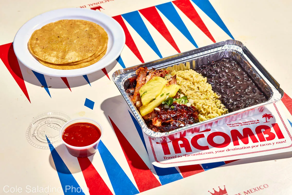 Al pastor plato with roasted pork, pineapple, onions, rice and beans