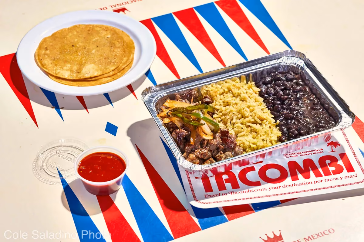Carne asada plato with caramelized onions, chiles toreados, rice and beans