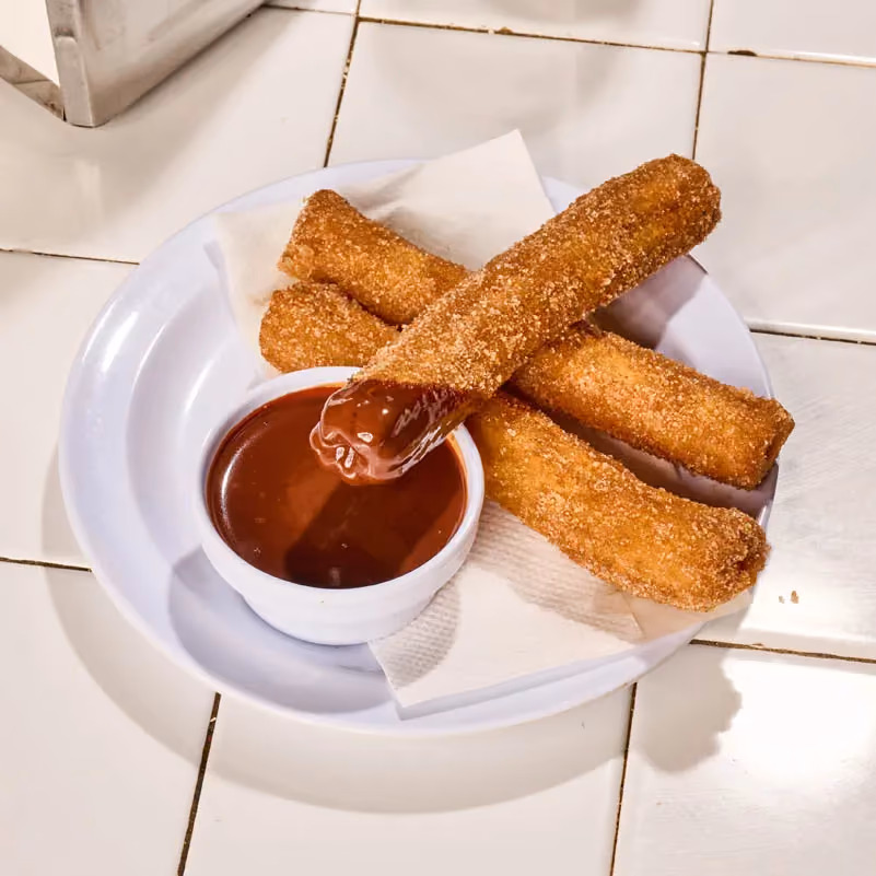 Churros dusted in cinnamon sugar served with Mexican chocolate sauce