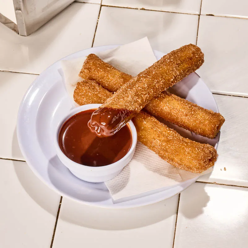 Churros dusted in cinnamon sugar served with Mexican chocolate sauce
