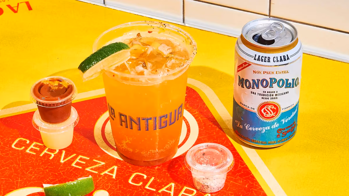 Michelada beer cocktail with spicy tomato mix