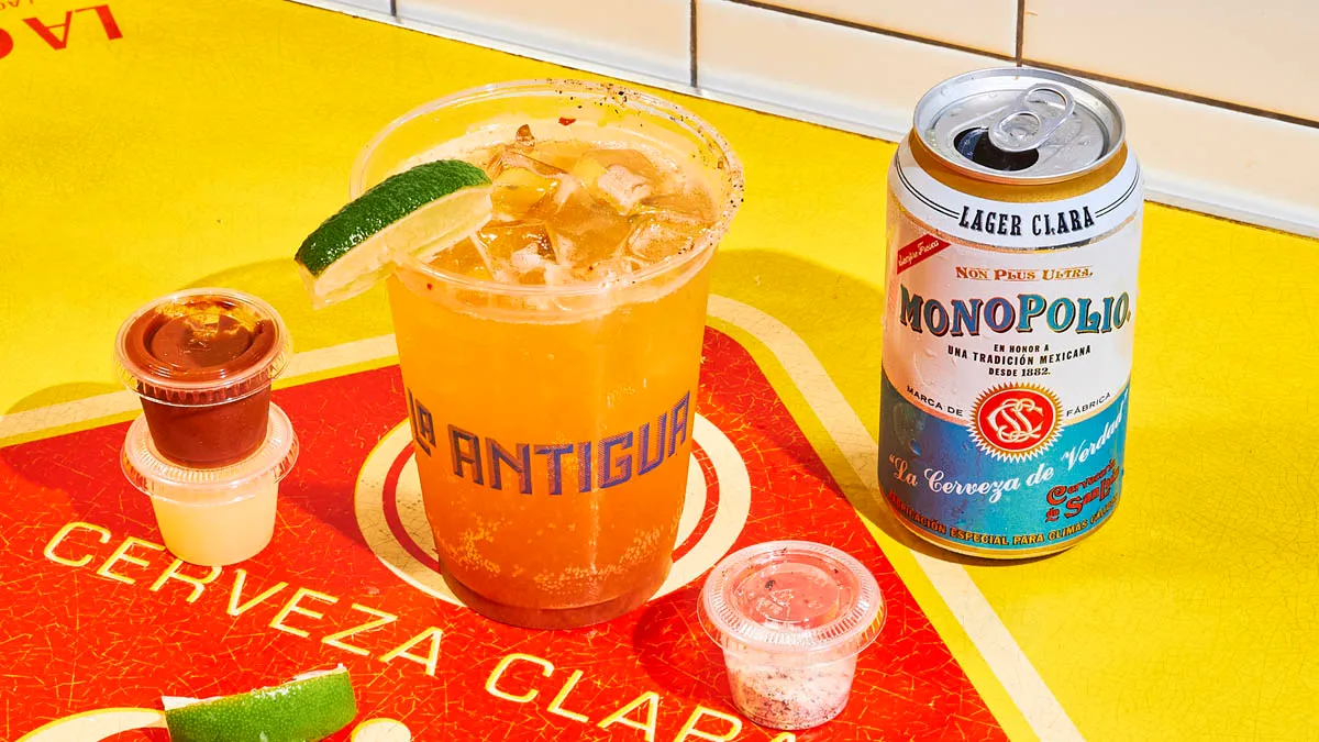 Michelada beer cocktail with spicy tomato mix