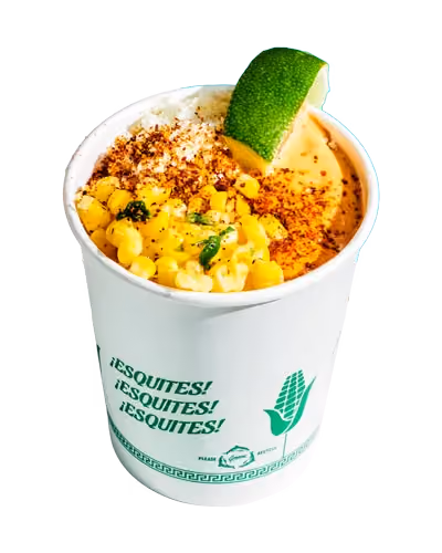 Cup of corn or grain salad topped with a red garnish