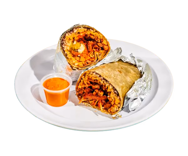 Plate of tacos with a side of orange salsa and lime