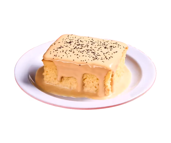 Slice of tres leches cake on a plate