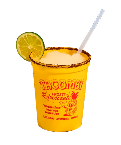Yellow cup of red fruit drink garnished with a lime slice