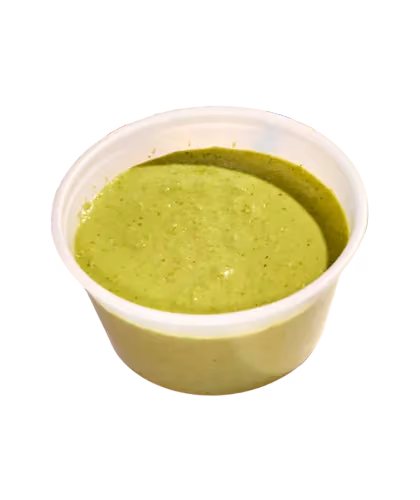 Small cup of green sauce or salsa verde