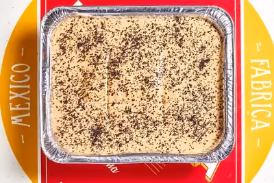 Our classic tres leches cake soaked in sweet three-milks, topped with airy cajeta whipped cream and finished with a delicate sprinkle of poppy seeds.