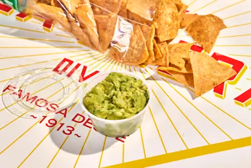 Guacamole con totopos made with Hass avocados, cilantro, jalapeño and lime