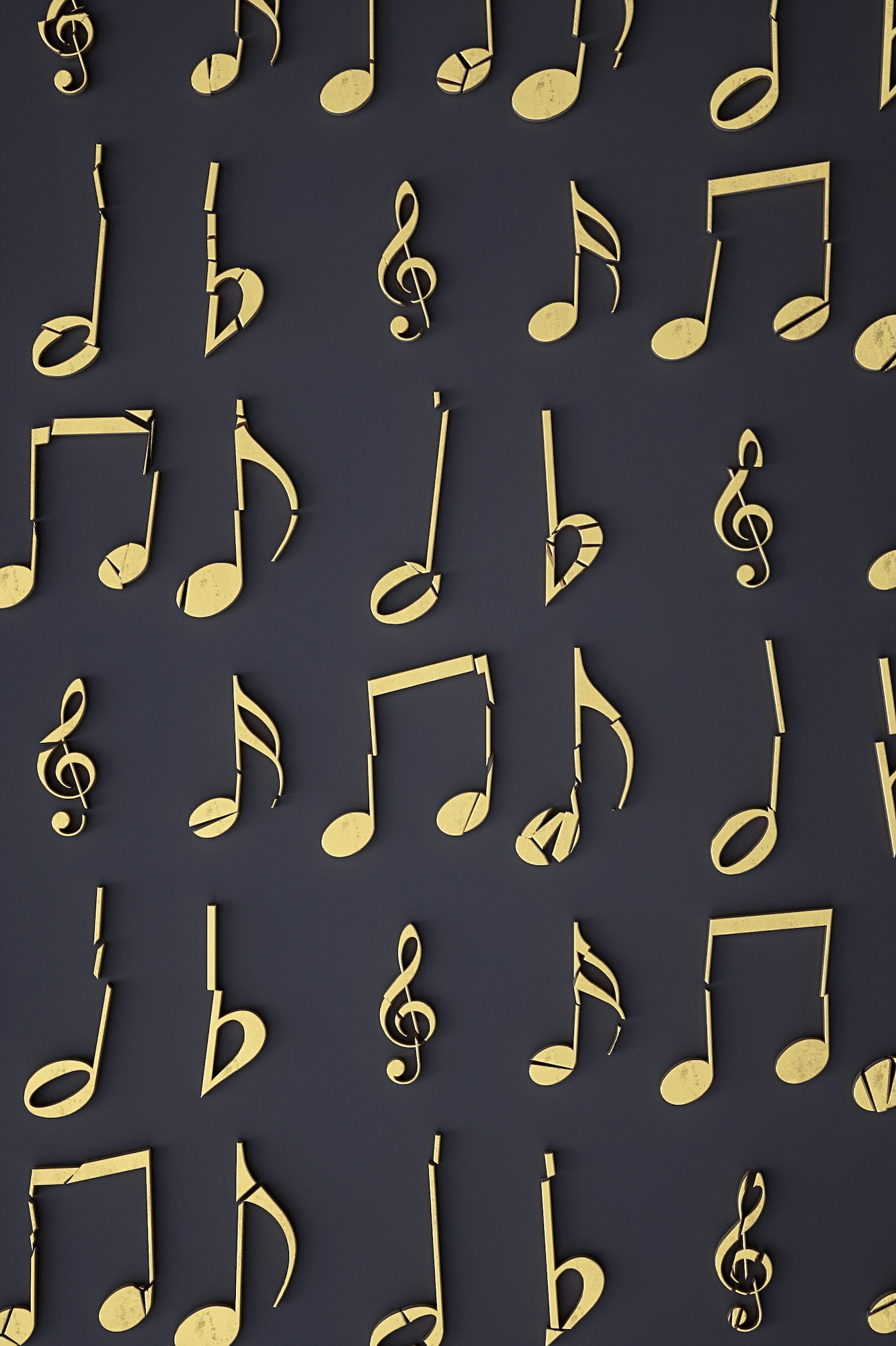 Notes de musique dorées anciennes disposées sur un fond gris foncé.