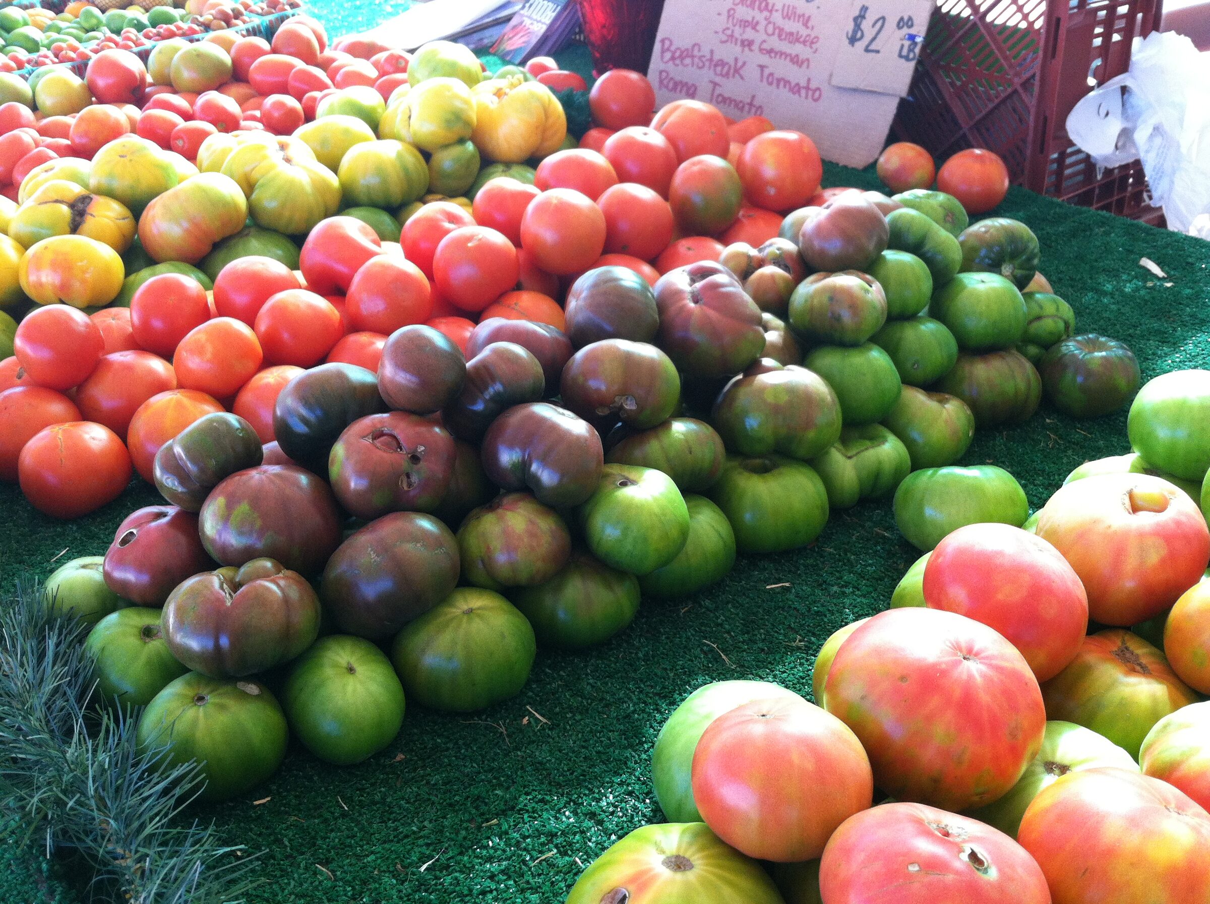 Colorful heirloom tomatoes on display at the Eli's Farms market stand