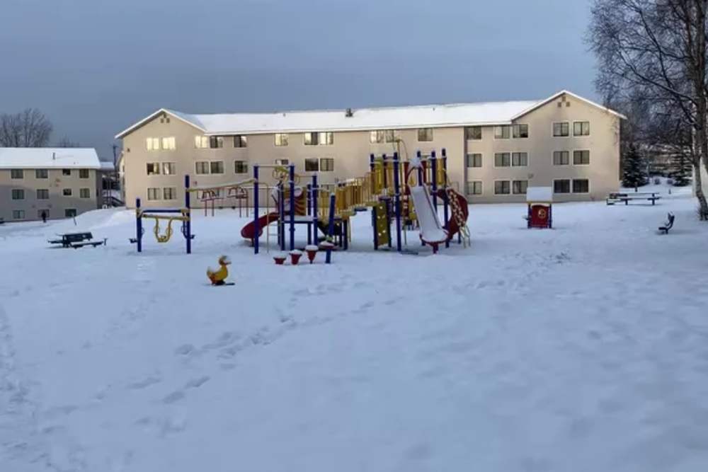 Exterior in winter with snow on playground