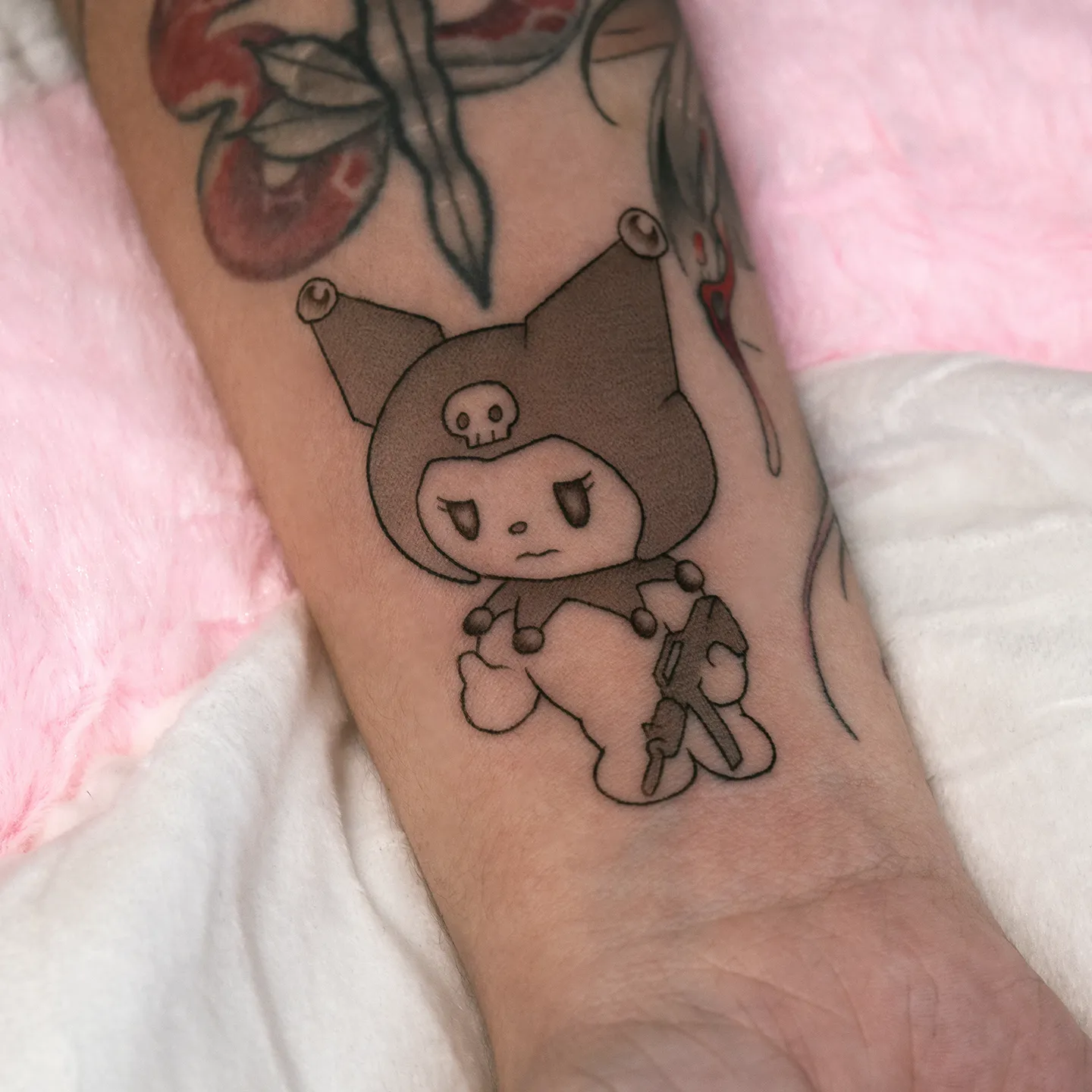 Dainty single-line Kurom tattoo