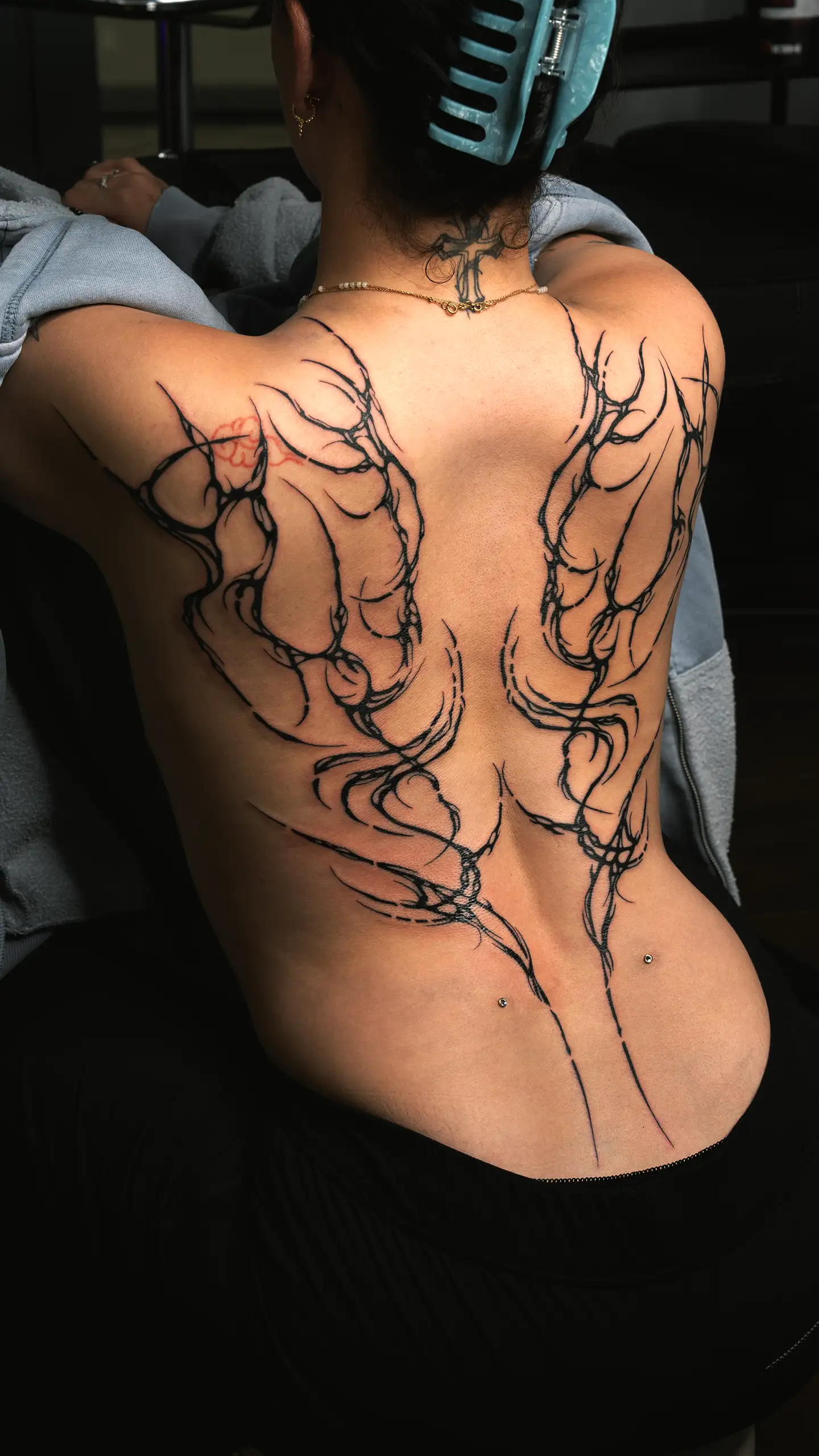 Womens feminine back tattoo