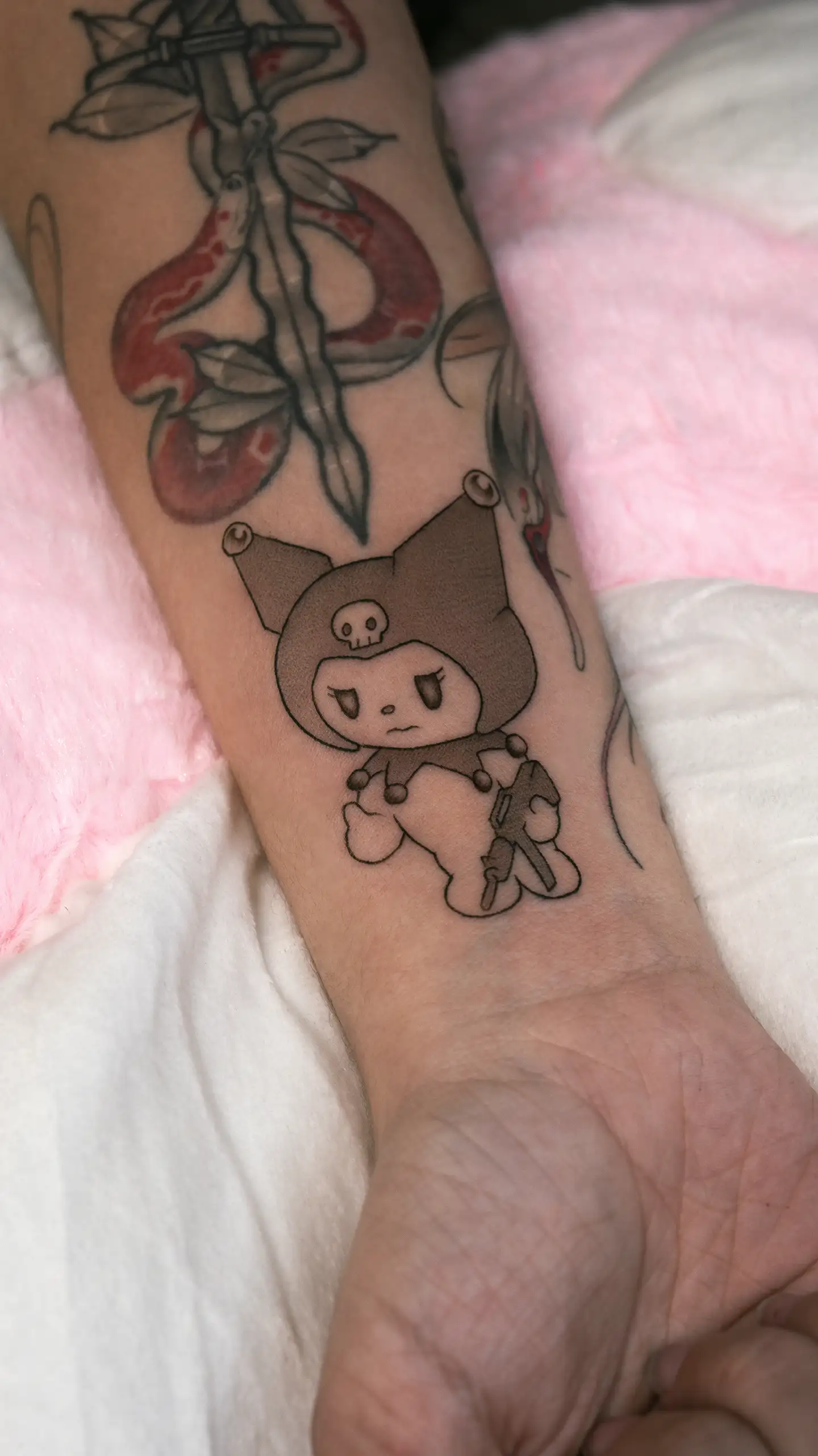 Small thin-line Sanrio tattoo
