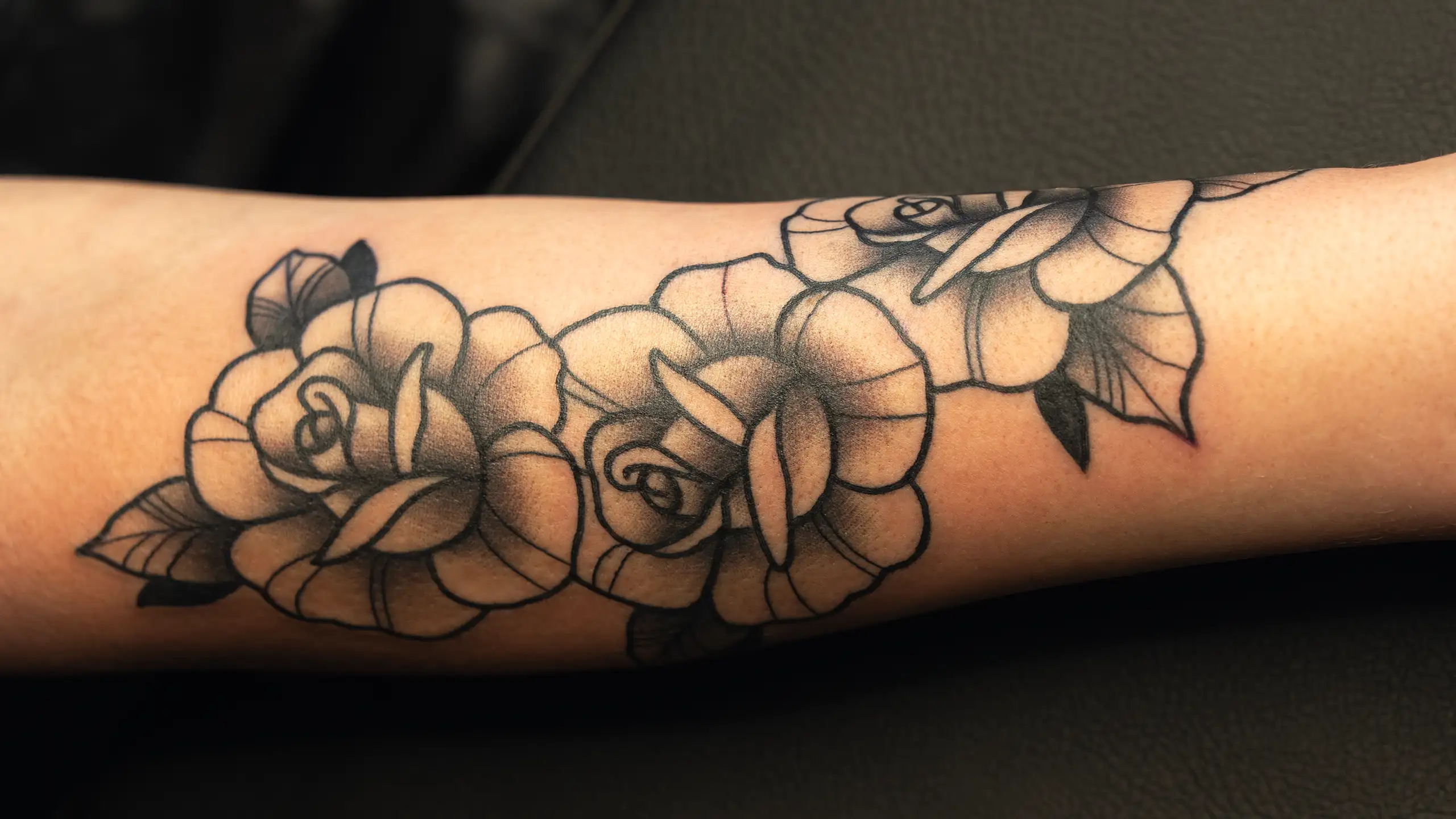 Traditional roses on the arm