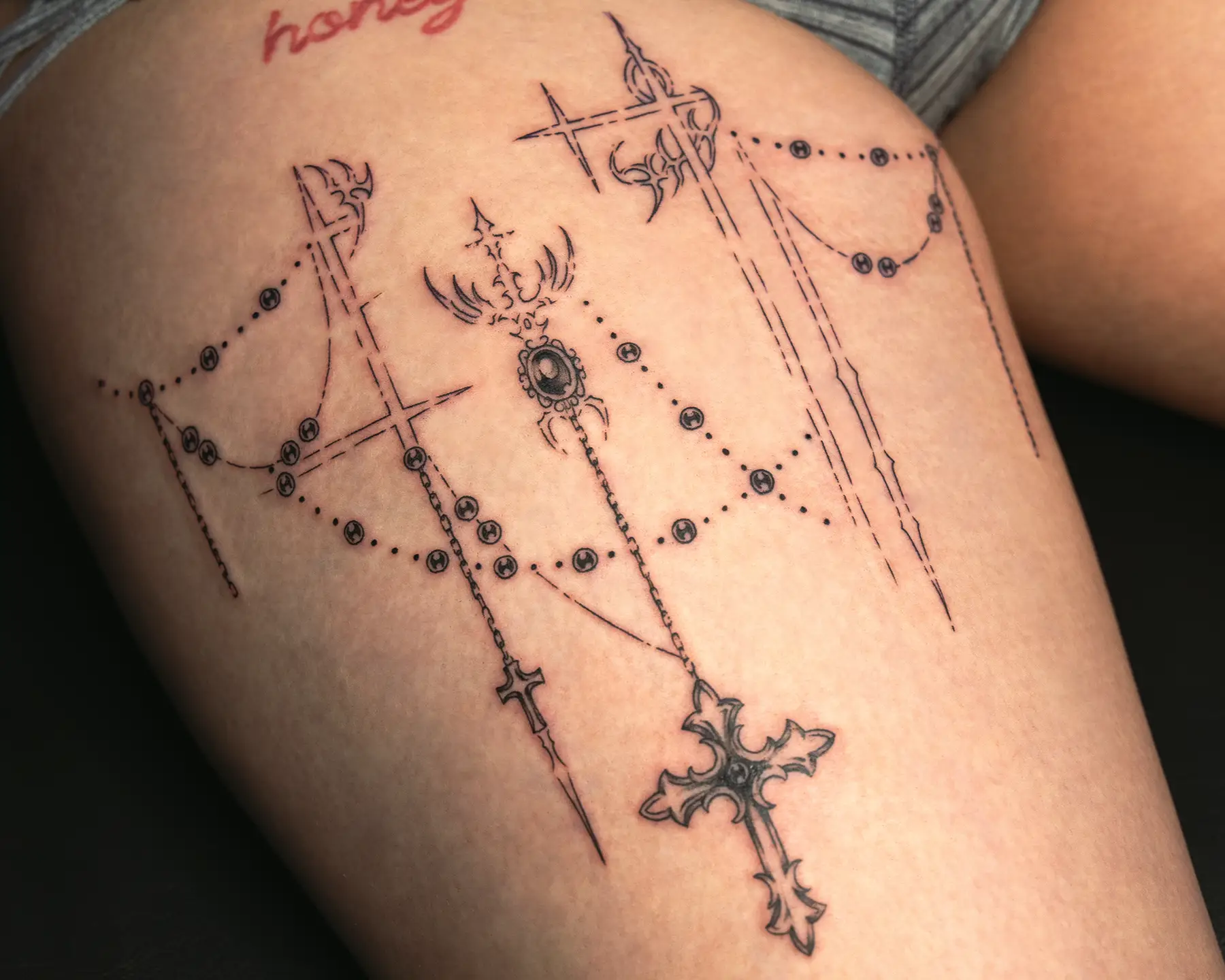 Ornamental thigh tattoo for women