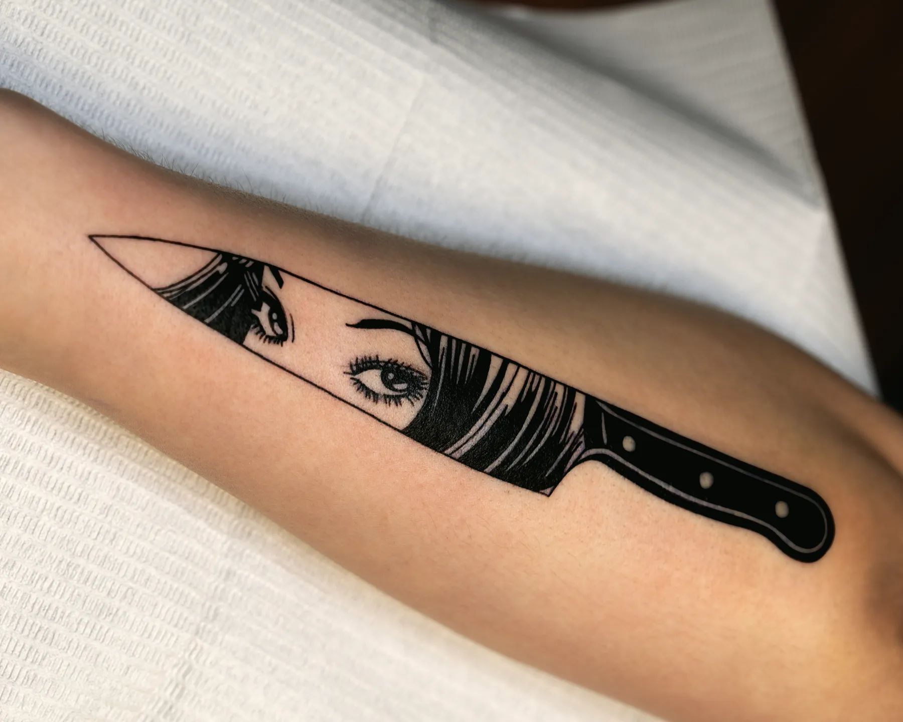 Blackout knife tattoo